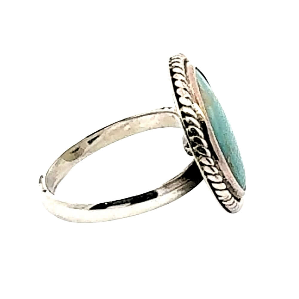 Silver ring with turquoise stone on a white background, other side