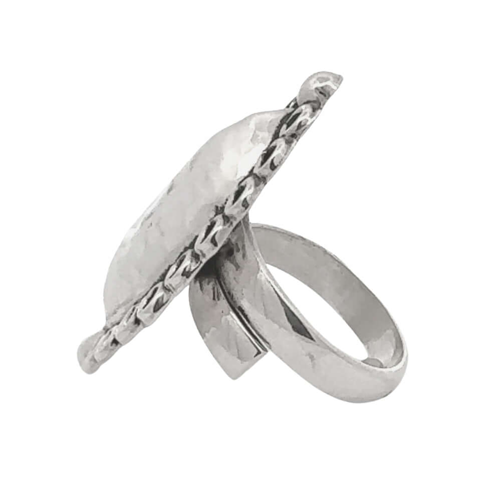Silver ring with a textured design on a white background
