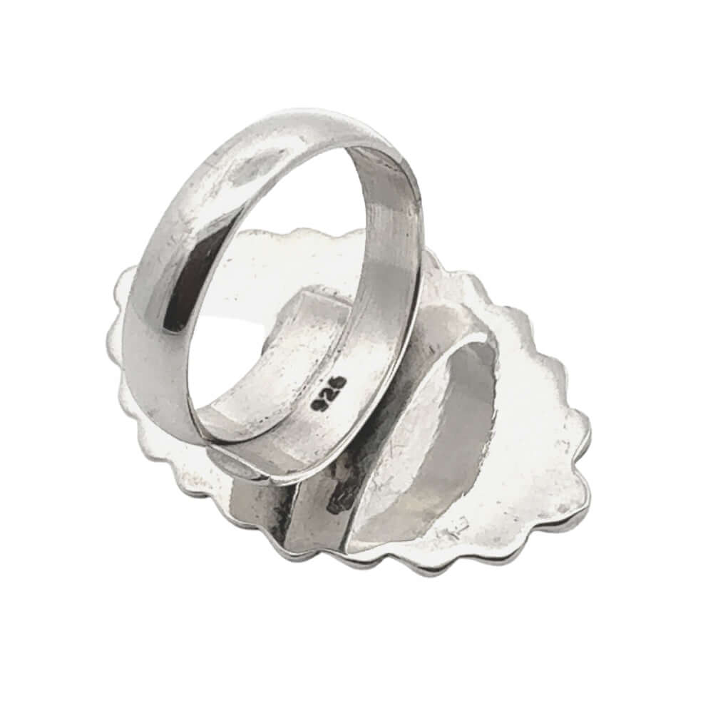 Silver ring on a white background showing 925 stamp