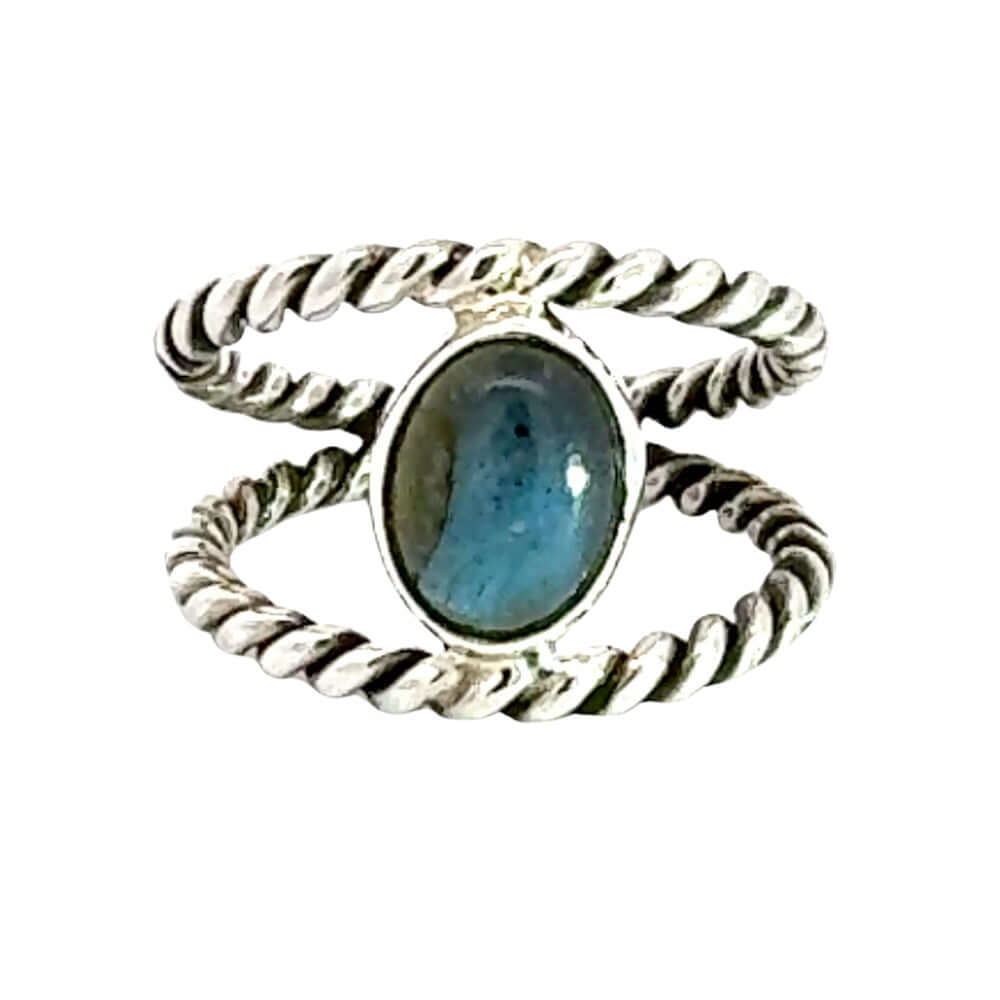Silver ring with a blue stone on a white background