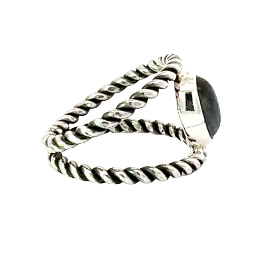 Silver ring with a gemstone on a white background