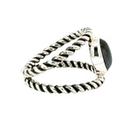 Silver ring with a gemstone on a white background