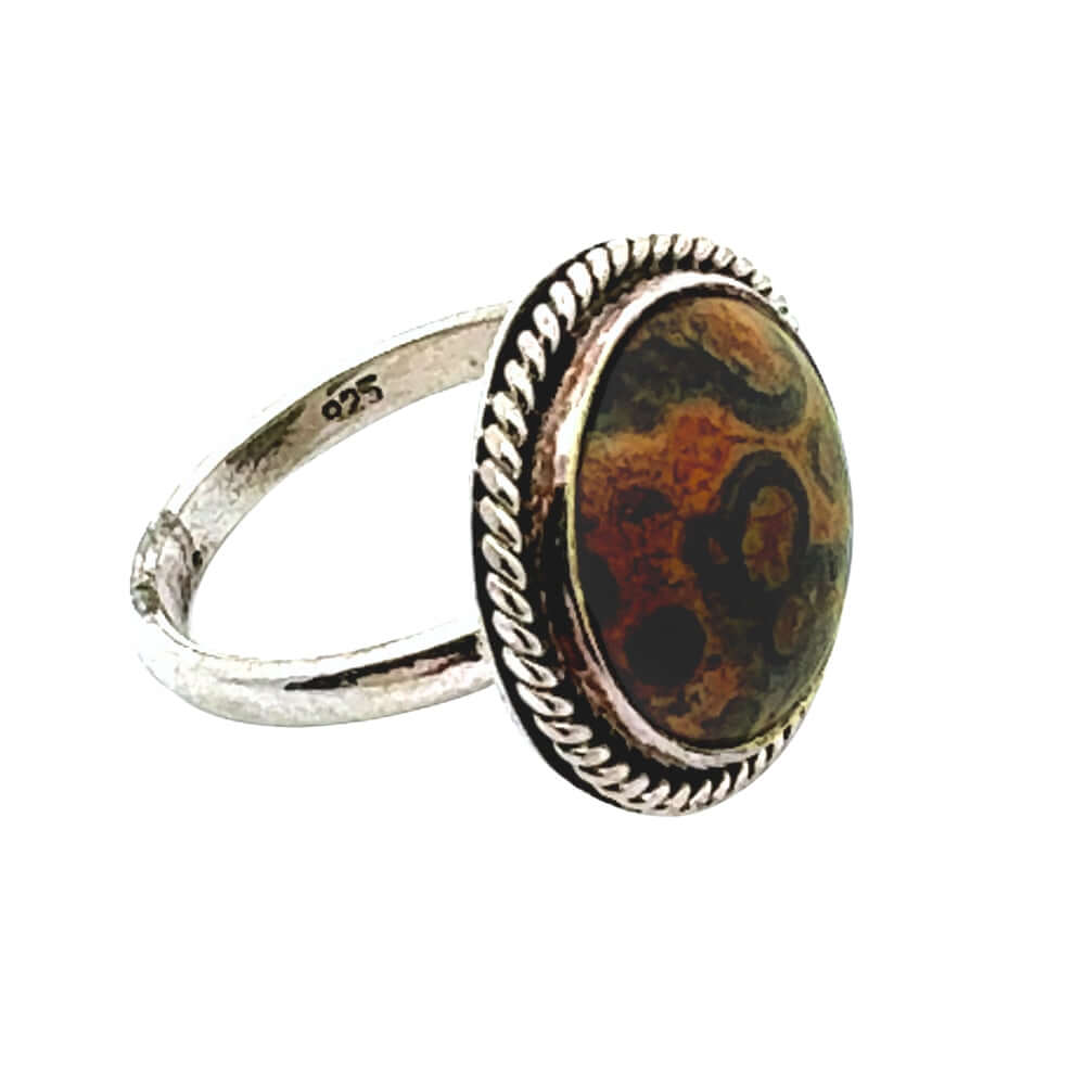 Silver ring with a brown and black patterned stone on a white background