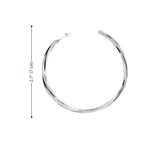 Silver hoop earrings with a measurement label on a white background