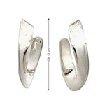 Silver hoop earrings with a measurement scale on a white background