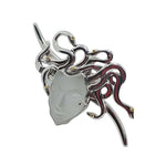 Decorative ring with a medusa design on a white background