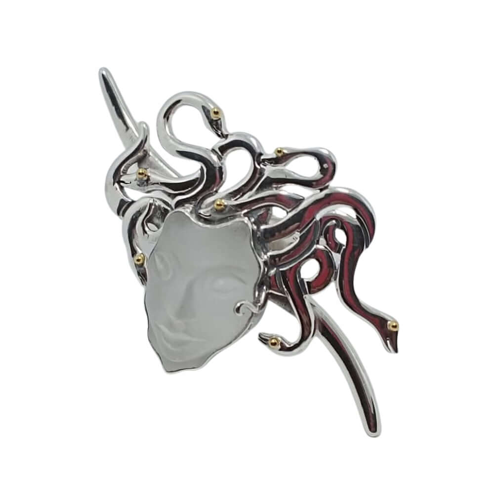 Decorative ring with a medusa design on a white background