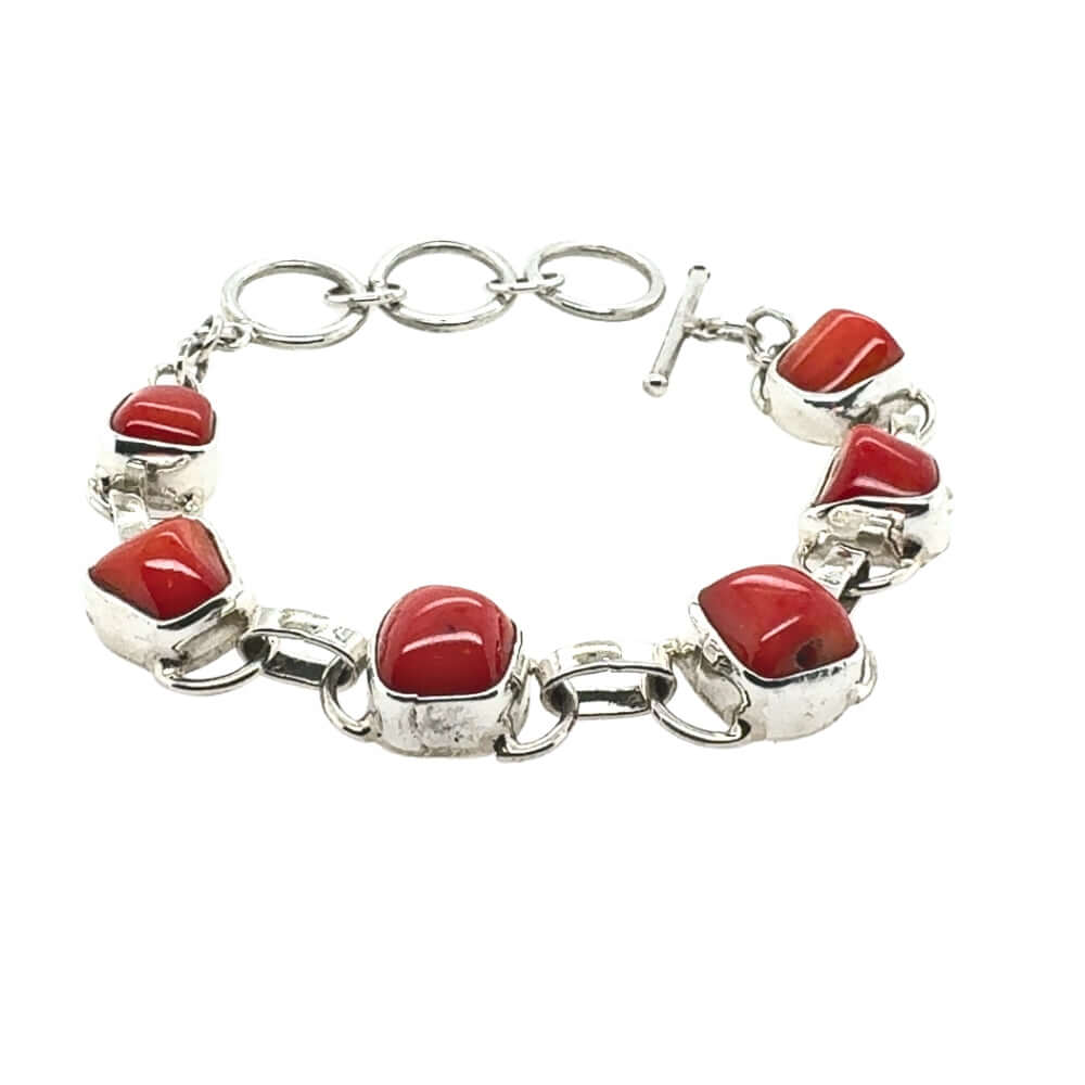 Silver bracelet with red coral' on a white background