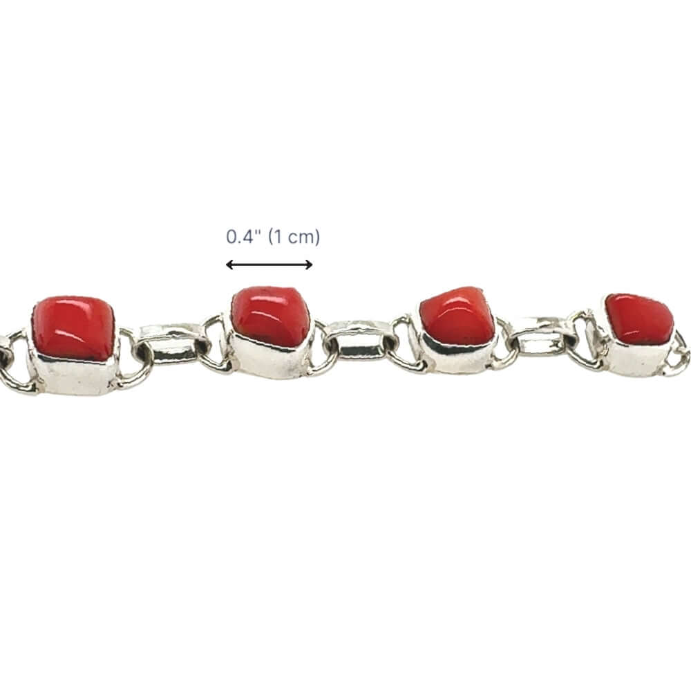 Bracelet with red coral and silver links on a white background and dimensions