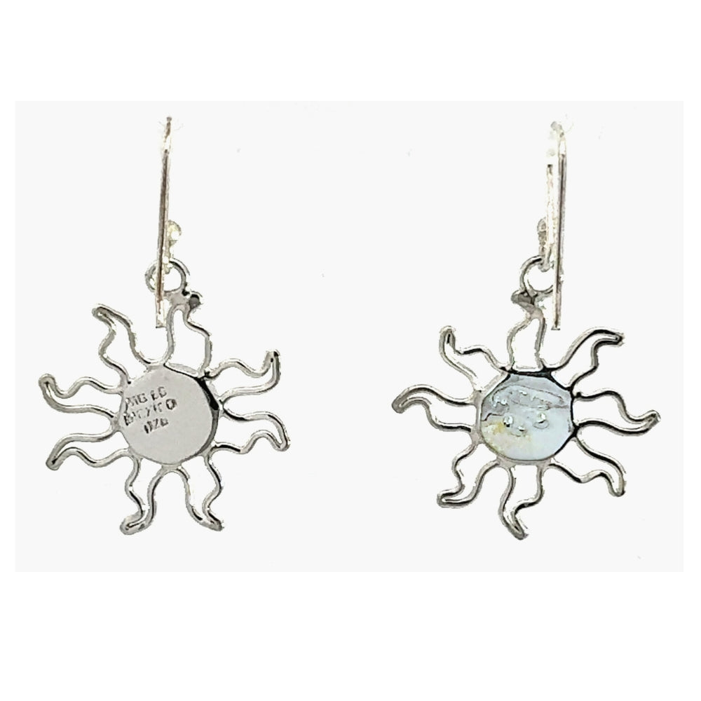 Silver sun-shaped earrings on a white background