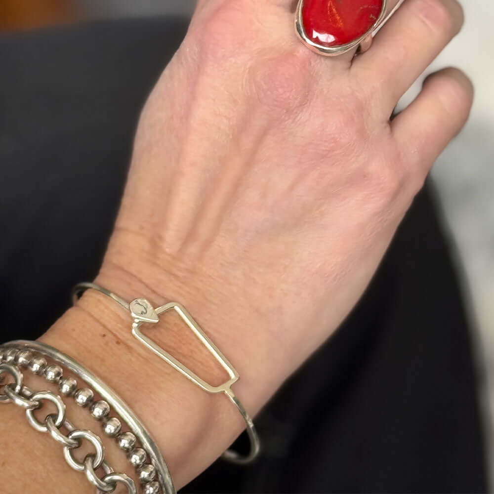 Minimalist-Sterling-Silver-Clasp-Bangle-with-model-Nueve-Sterling