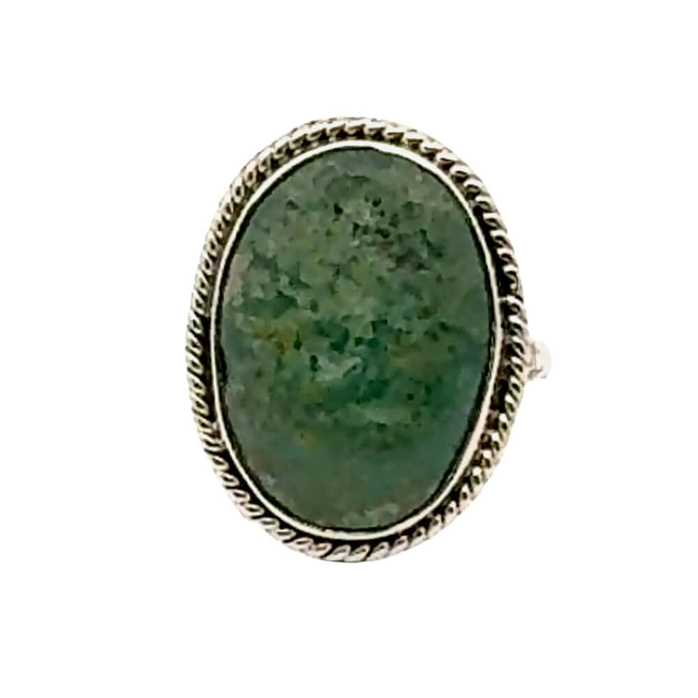 Ring with a green stone and silver band on a white background
