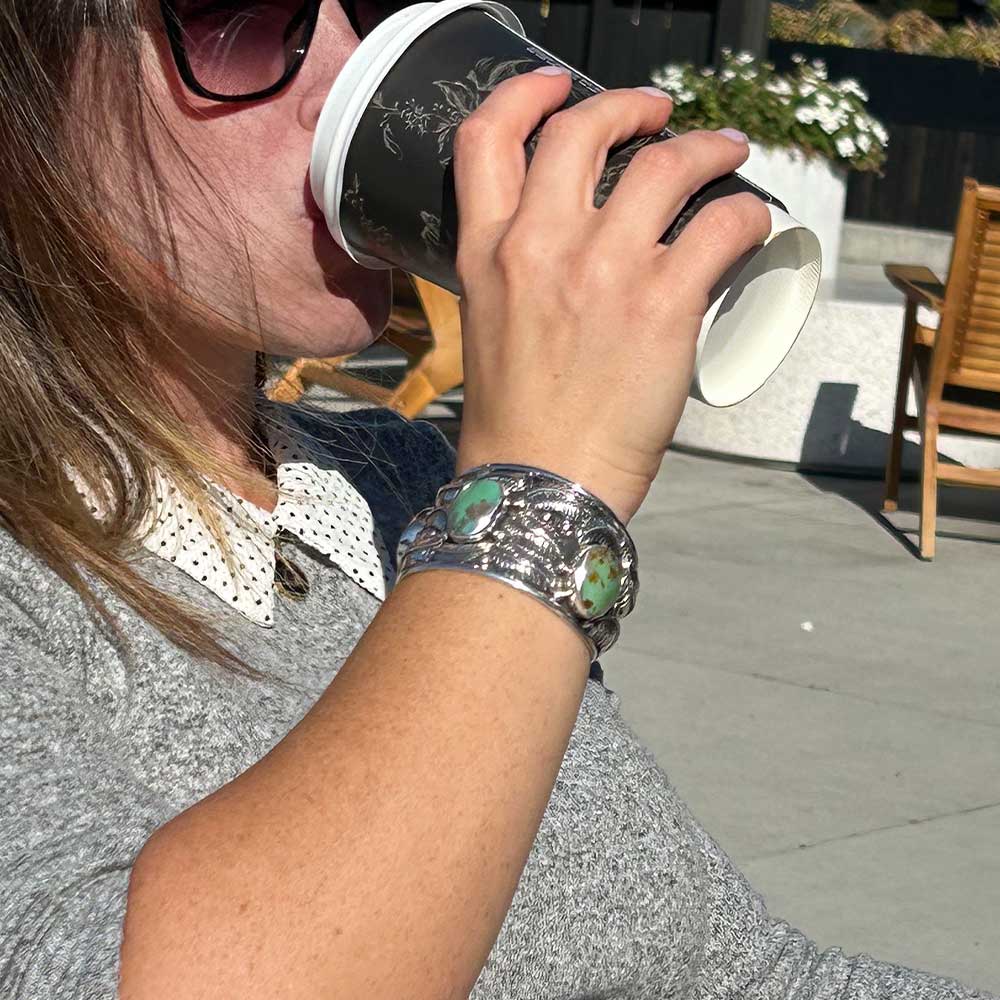 Navajo-Inspired-Green-Turquoise-Leaves-Silver-Cuff-Bracelet-with-model-Nueve-Sterling