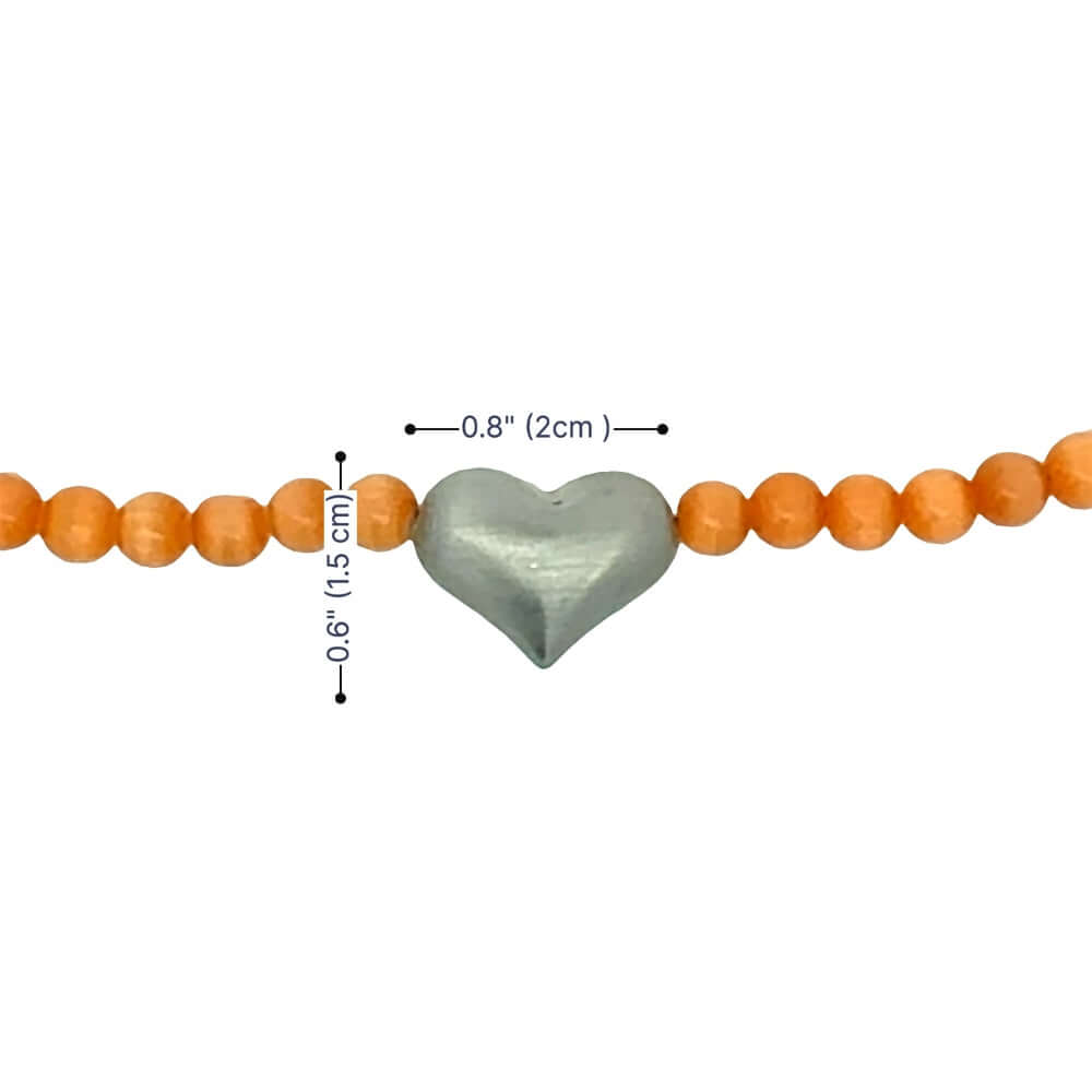 Beaded cats eye bracelet with a heart-shaped silver centre piece and measurements on a white background