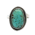 Turquoise ring with silver band on a white background