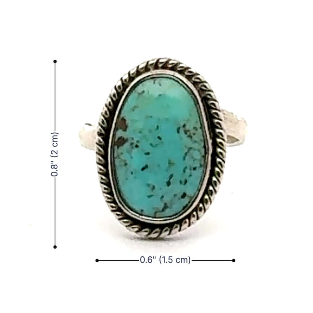 Turquoise ring with silver band and measurements on a white background
