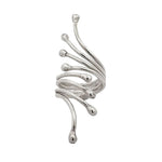 Silver sculptural ring on a white background
