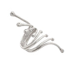 Silver ring with a wavy design on a white background