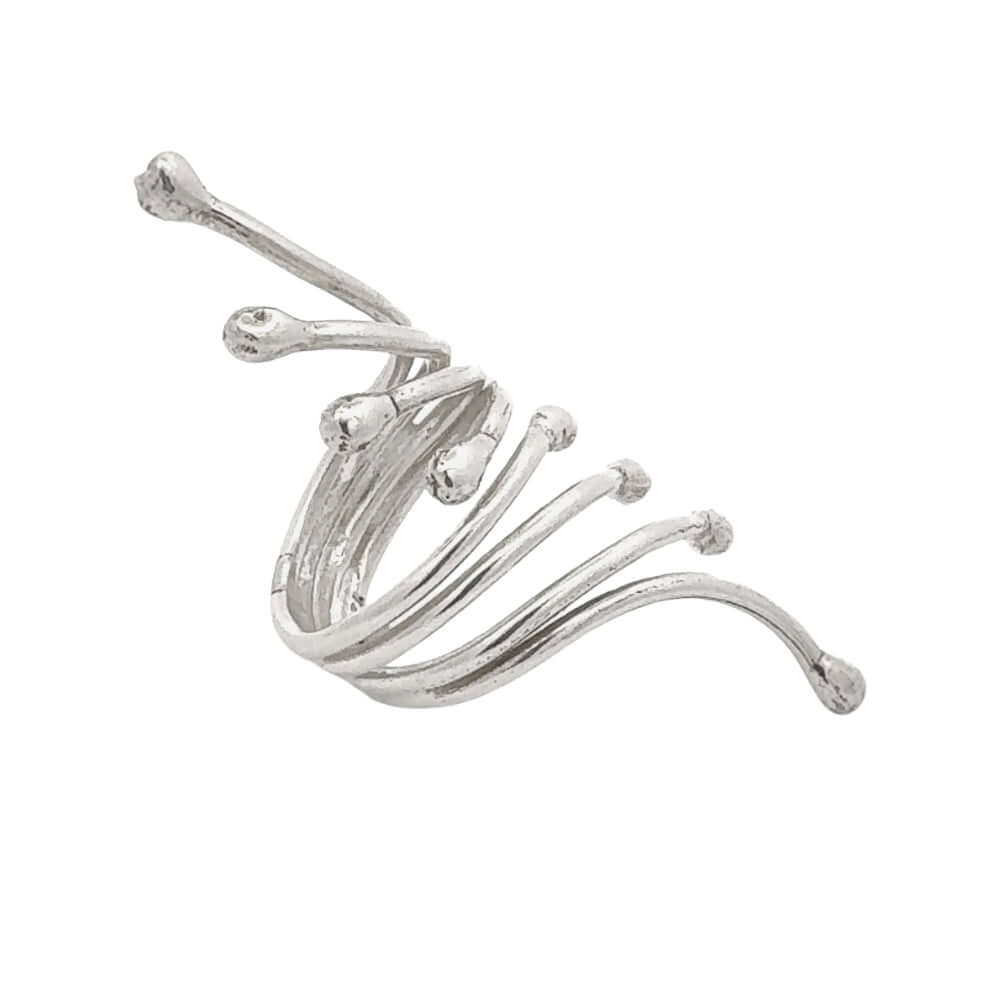 Silver ring with a wavy design on a white background