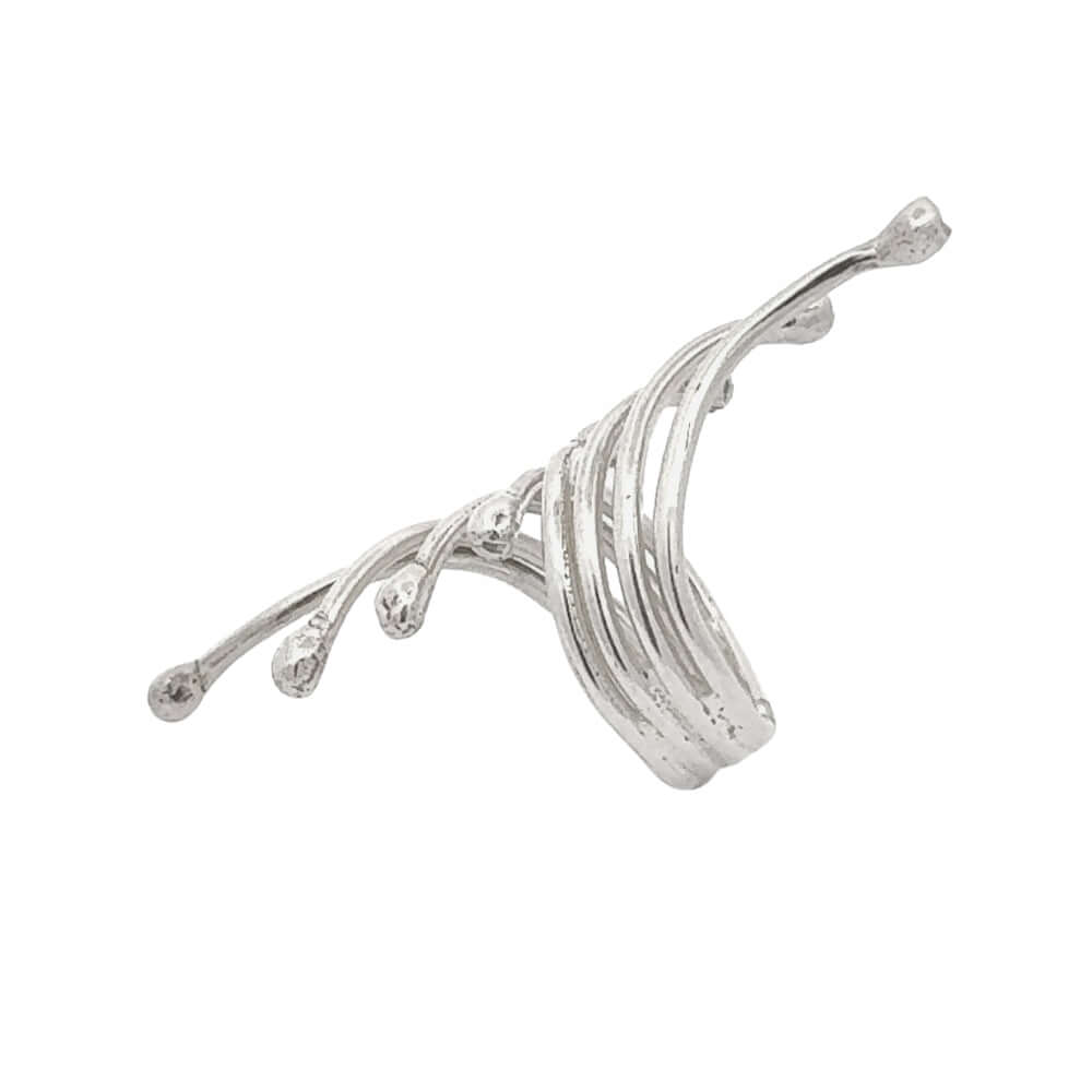 Silver branch-like jewelry piece on a white background