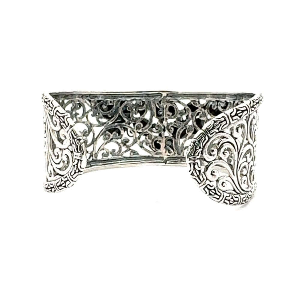 Silver filigree bracelet on a white background