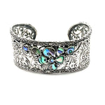 Decorative silver cuff-bracelety with colorful abalone on a white background