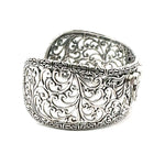 Silver bracelet with intricate filigree design on a white background