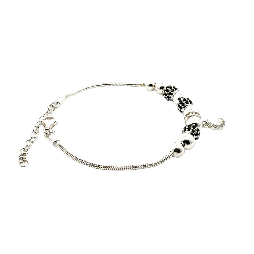 Silver bracelet with beads on a white background