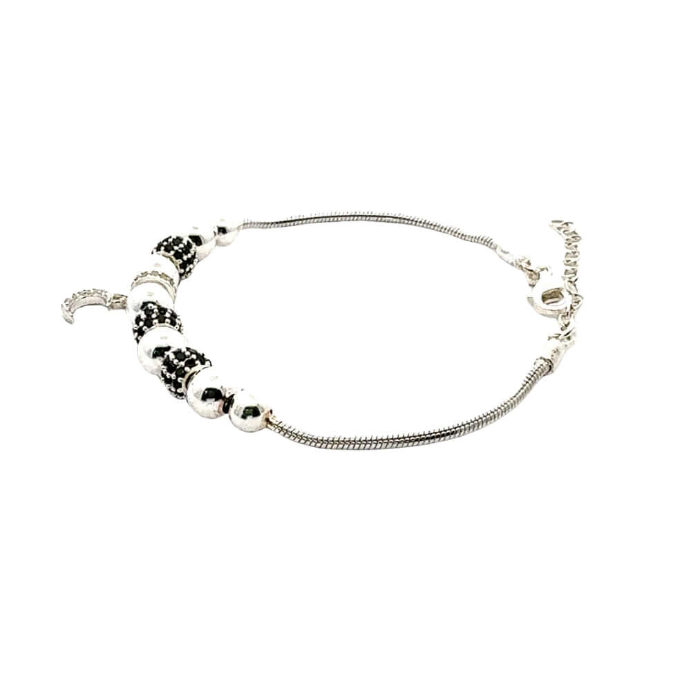 Silver bracelet with beads on a white background