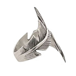 Silver ring with feather design on a white background