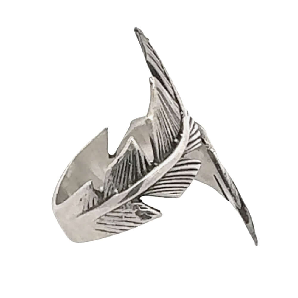 Silver ring with feather design on a white background