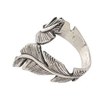 Silver ring with leaf design on a white background