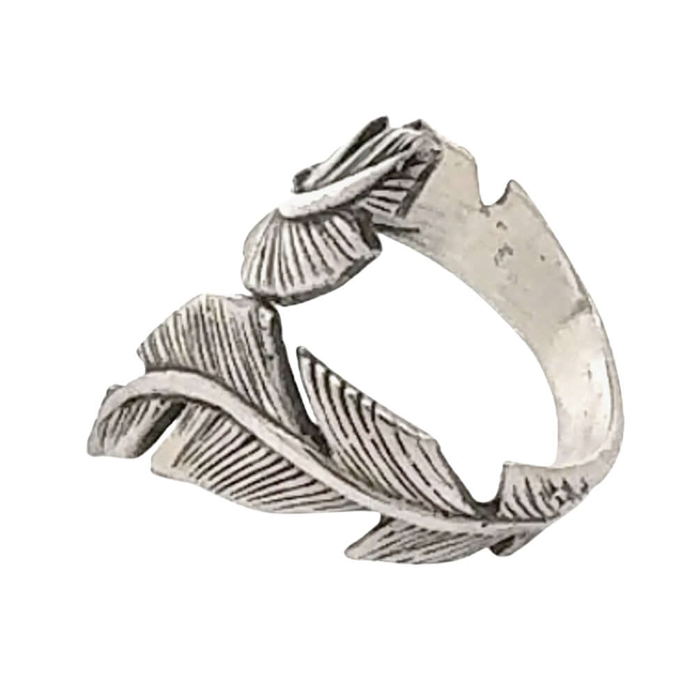 Silver ring with leaf design on a white background