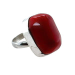 Ring with a red coral and silver band on a white background