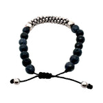 Blue agates beaded bracelet with silver accents on a white background