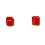 Pair of red coral square earrings on a white background