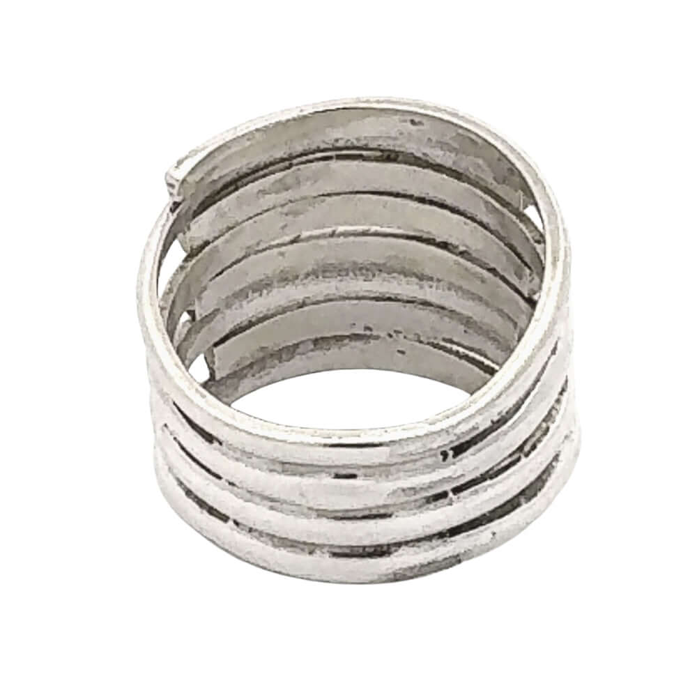Silver ring with multiple concentric bands on a white background