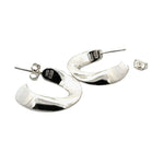 Silver hoop earrings on a white background