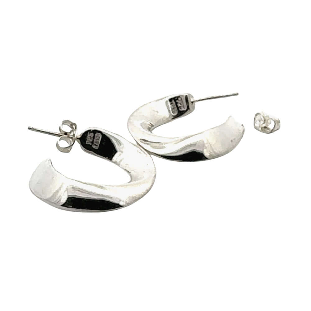 Silver hoop earrings on a white background
