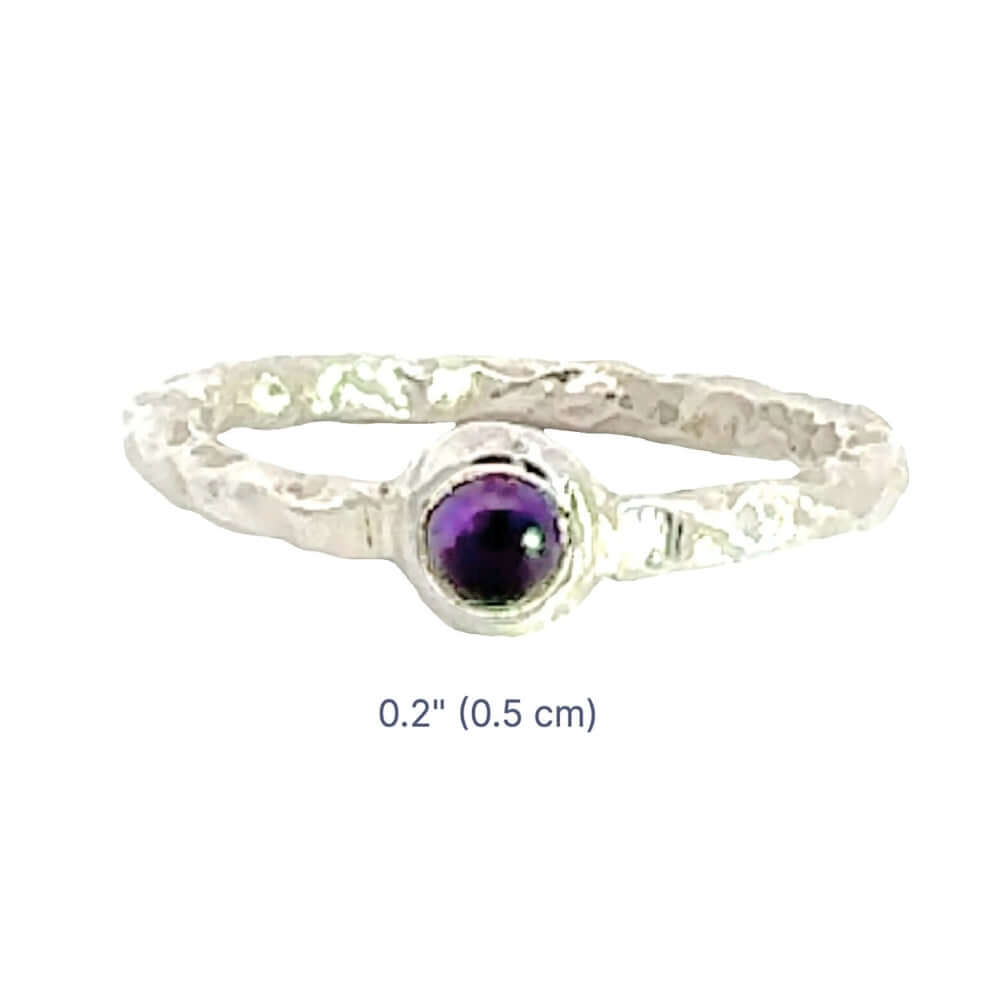 Silver ring with a purple gemstone on a white background with dimensions