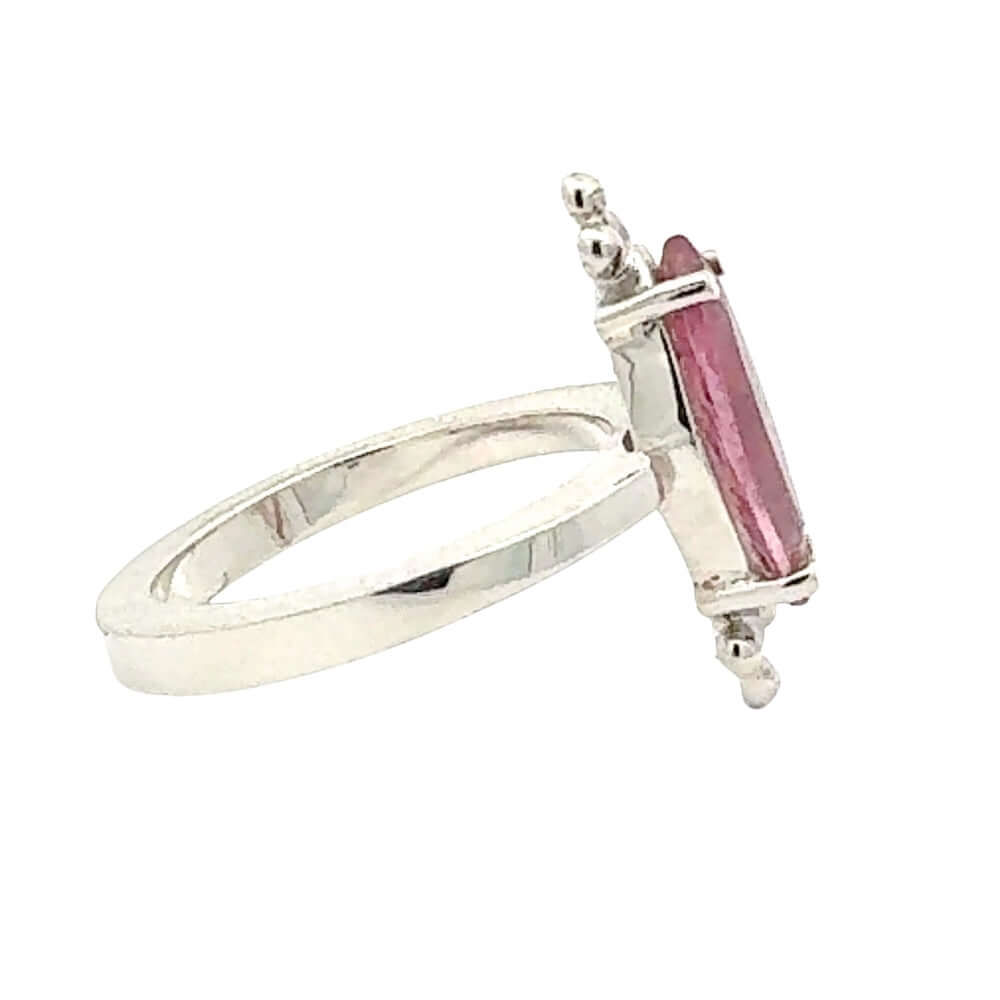 Side of a Taxco Silver ring with a pink gemstone on a white background