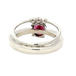 Silver ring with a pink gemstone on a white background