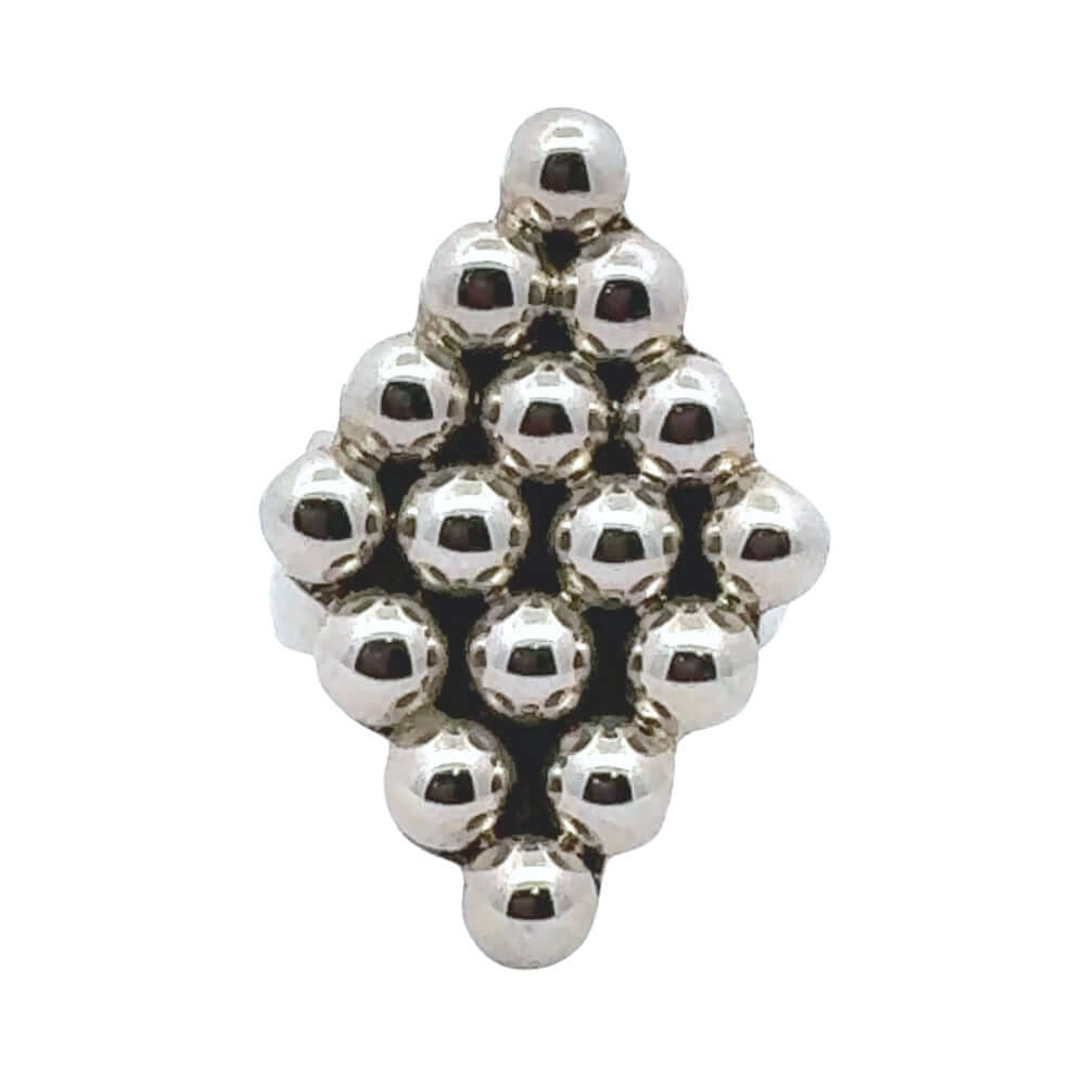 Adjustable sterling silver ring from Taxco with a geometric bead design on a white background.