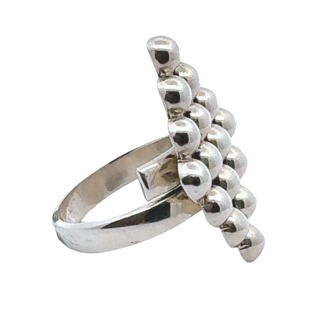 Taxco silver ring with bead design on a white background