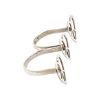 Silver ring with heart design on a white background