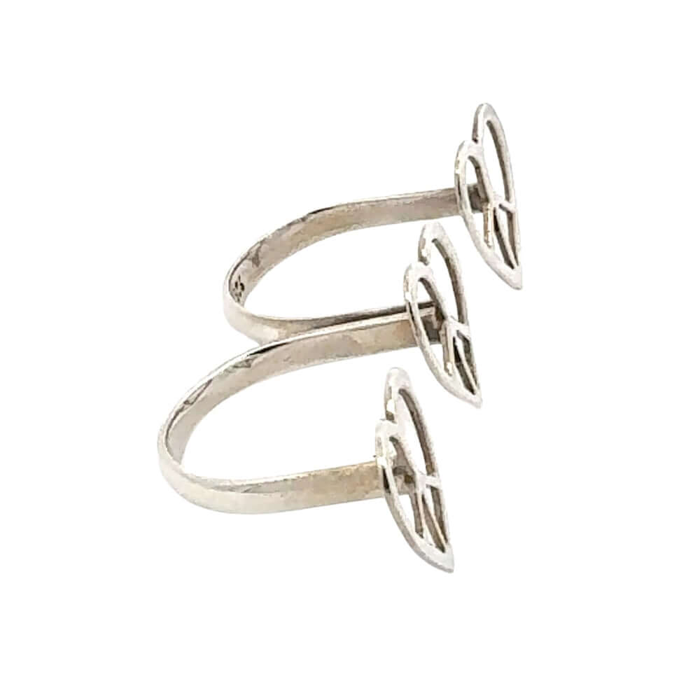 Silver ring with heart design on a white background