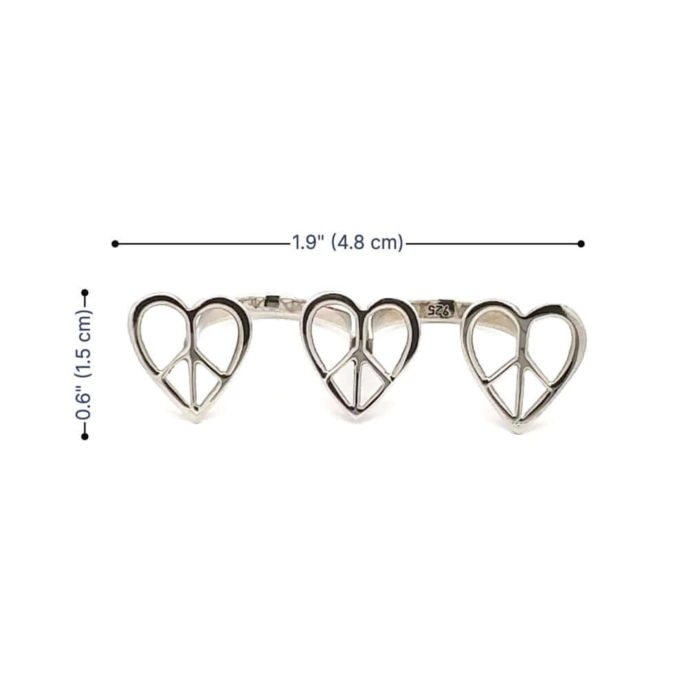 Silver heart-shaped peace sign ring with measurements on a white background