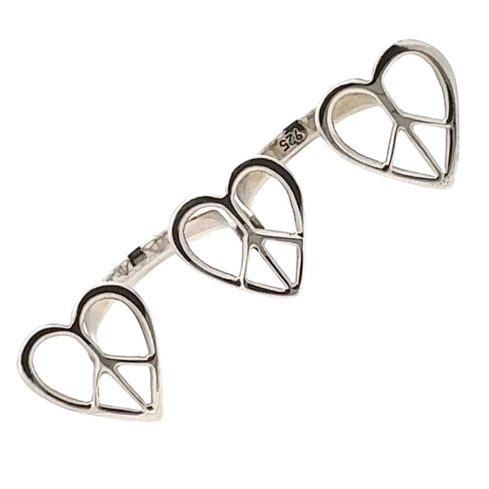 Silver peace sign heart-shaped ring on a white background