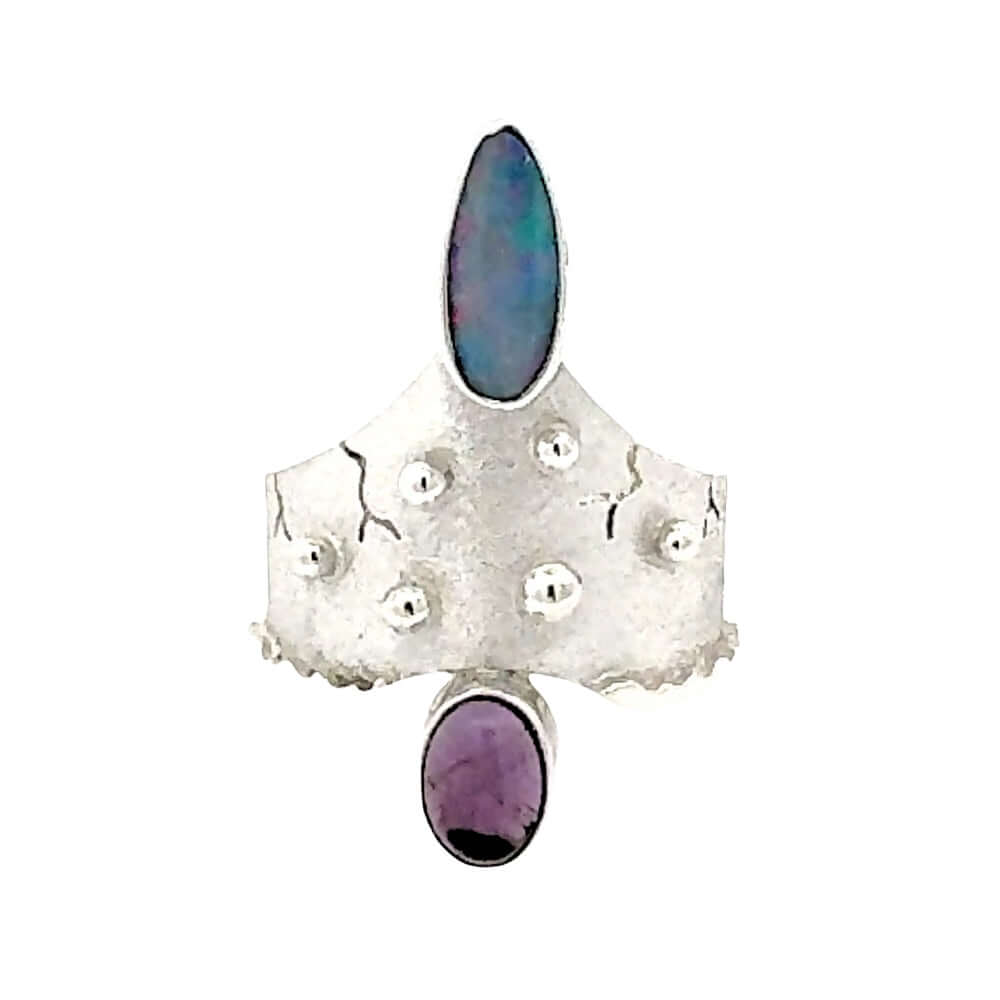 Front view of the 950 silver statement ring by Daniel Gutierrez featuring a fiery Australian opal and oval amethyst.