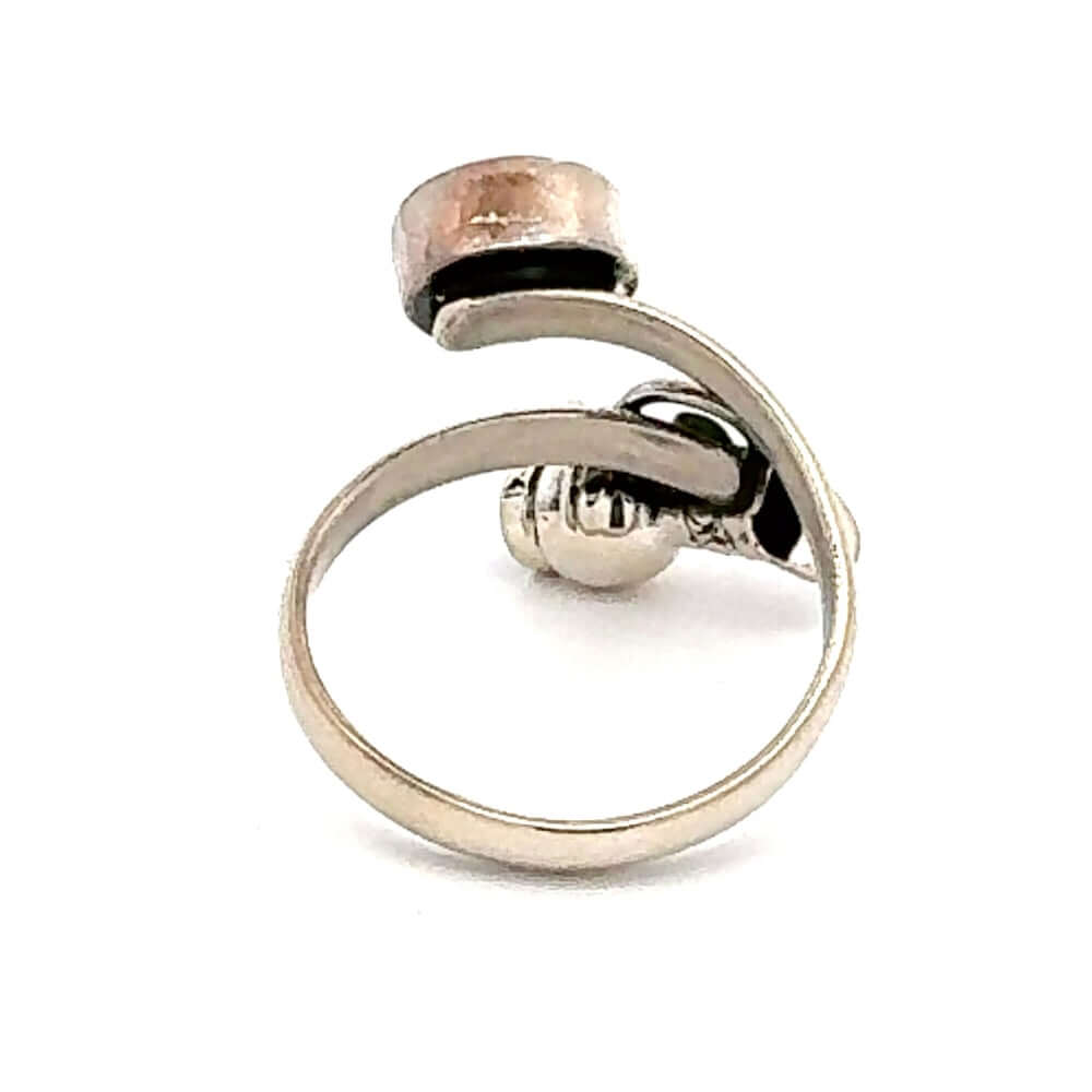 Back view of the bypass ring design showing the comfortable and slightly adjustable 950 silver band.